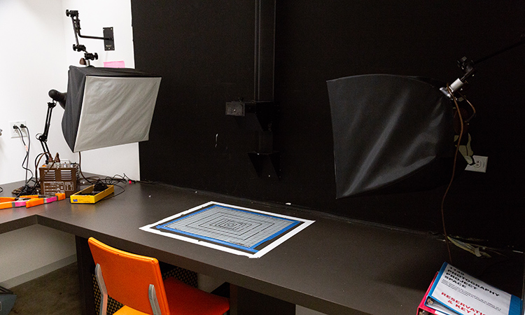 Photo lights and work area in the Photography copy stand room